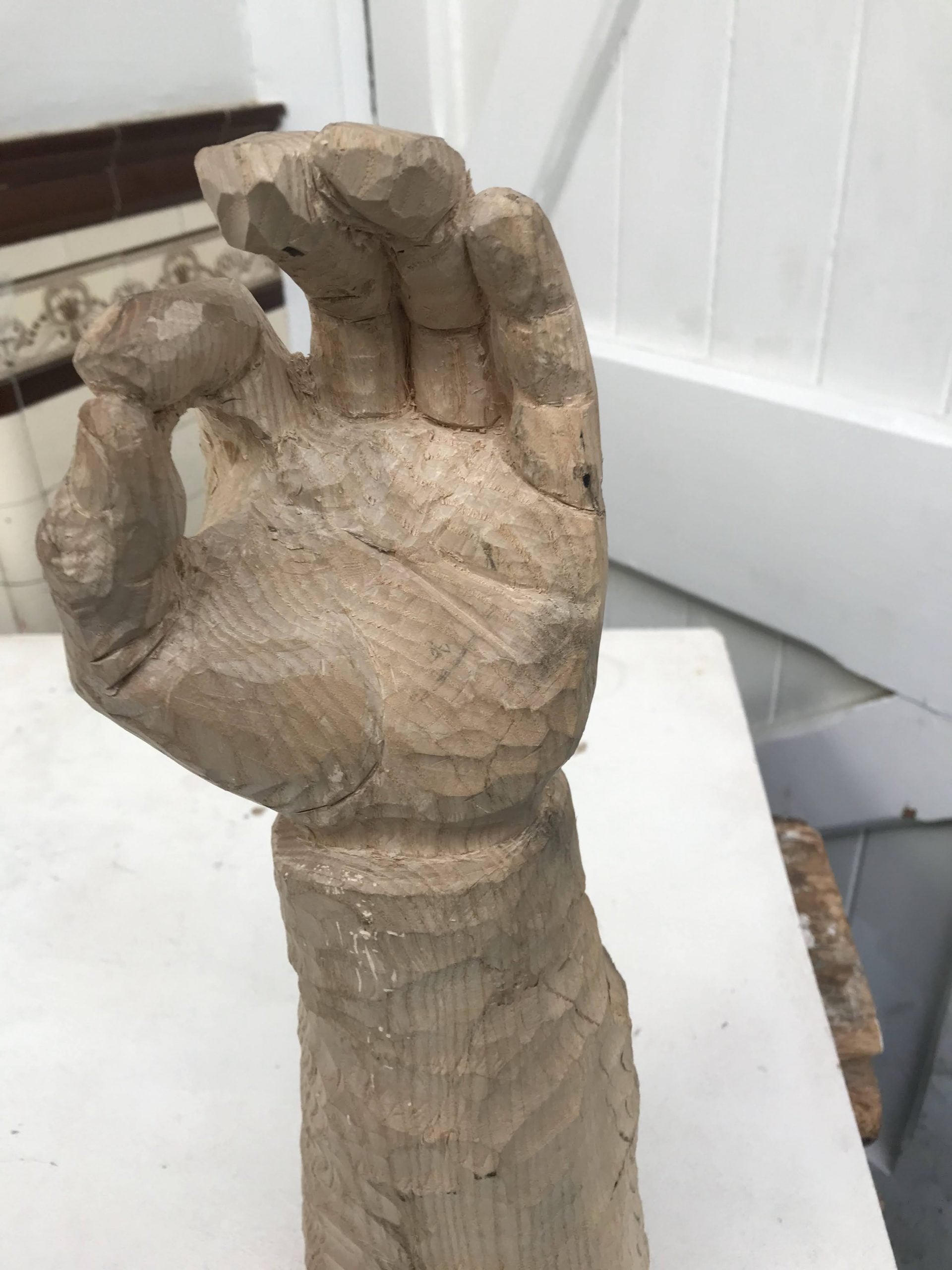 Wooden hand sculpture.